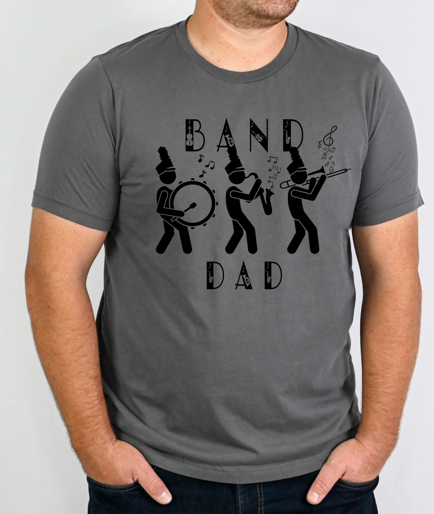 A person wearing a gray t-shirt with the text 'BAND DAD' printed on the front, along with a graphic of three band members.