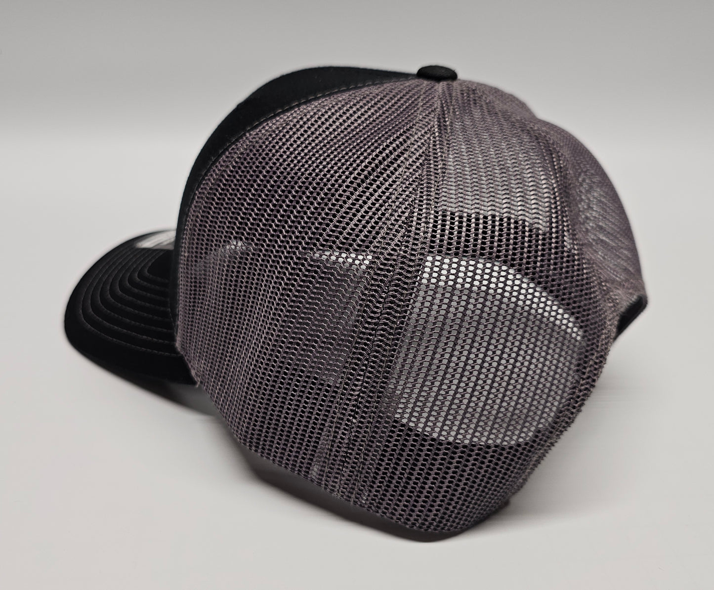 Laser Engraved Leatherette Patch Trucker Hat.