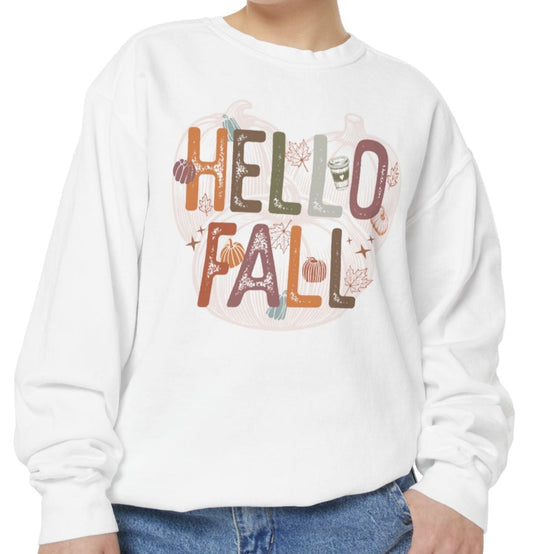 Person wearing a white sweatshirt with 'Hello Fall' text and autumn-themed graphics on a white background